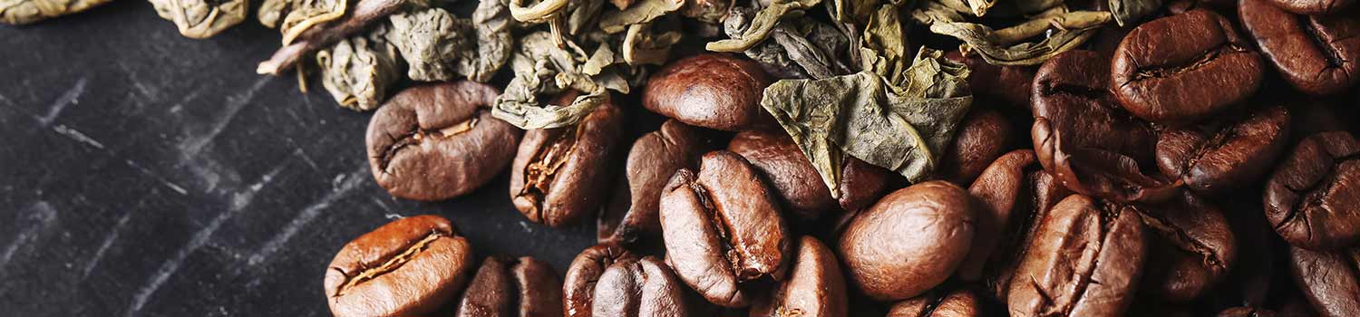 Dried green tea Leaves and coffee beans with caffeine