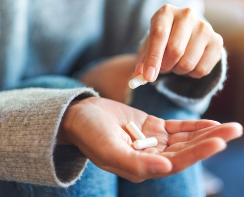 Nutritional Supplement Capsules in a woman's hand