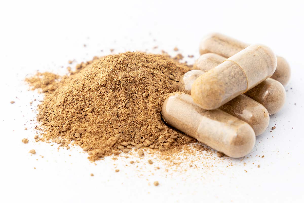 Capsules next to powder