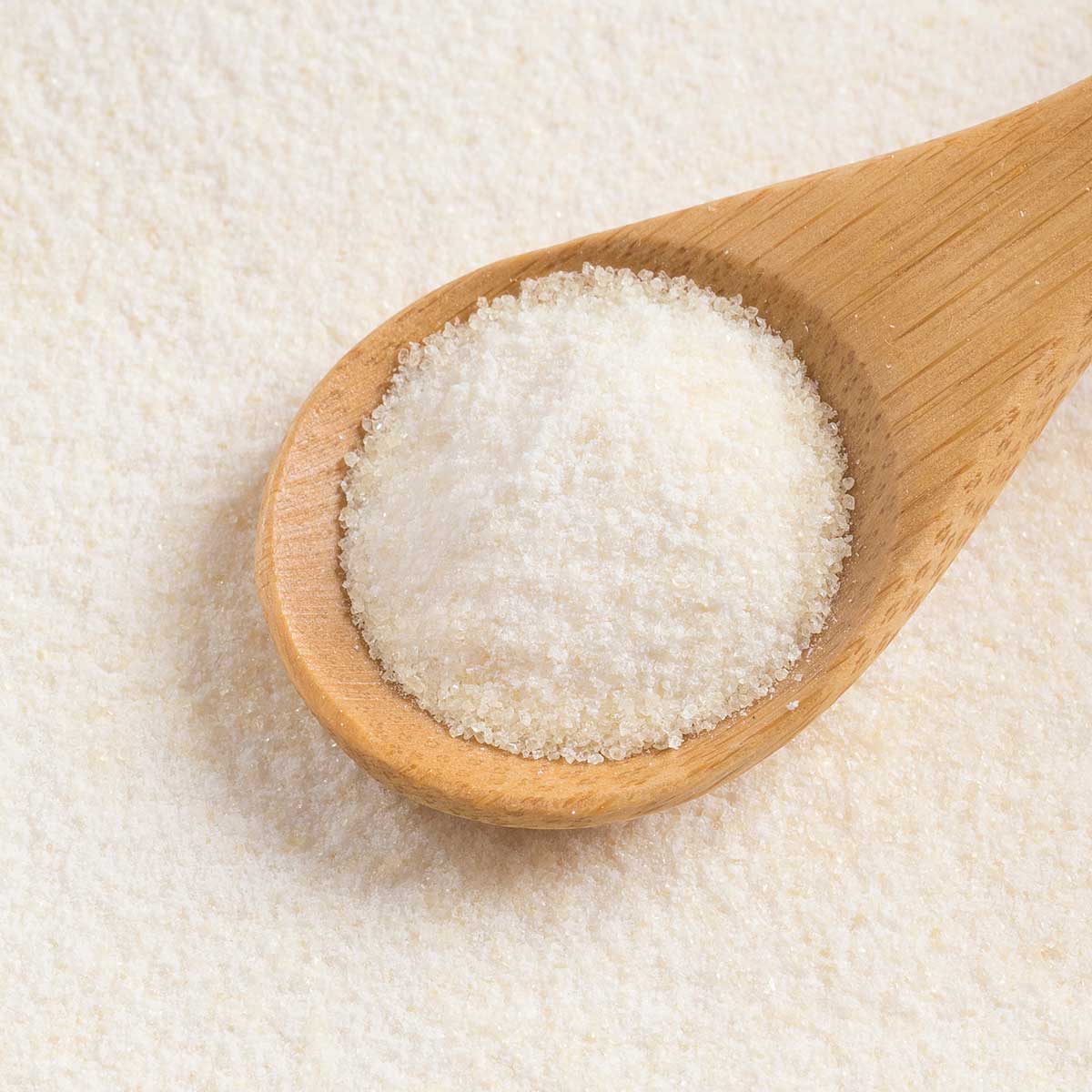 collagen powder in a wooden spoon