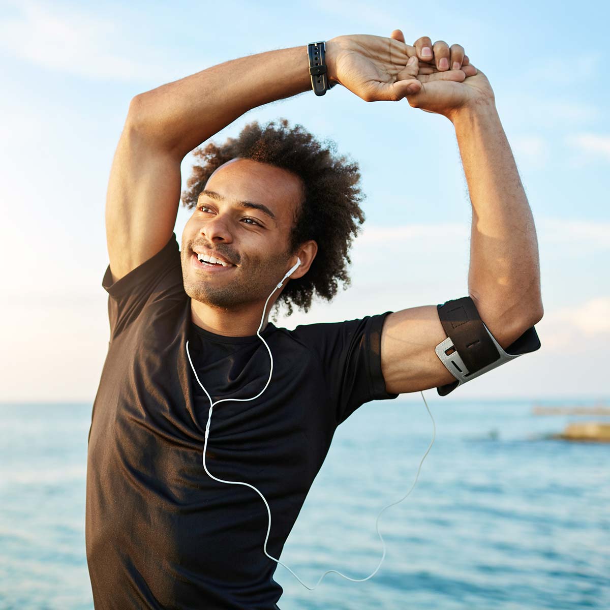 man exercising on the beach