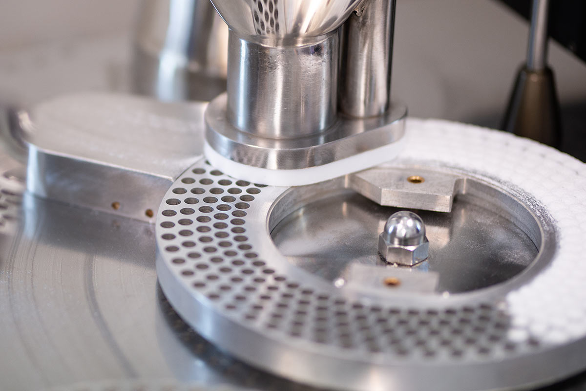 Encapsulation machine for manufacturing dietary supplement capsules