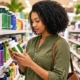 a woman reading the label of a nutritional supplement in the health food store