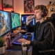 young man drinking an energy drink to support his gaming routine