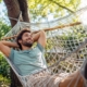 man relaxing in a hammock during the summer